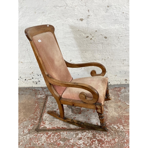 98 - A 19th century beech and fabric upholstered rocking chair
