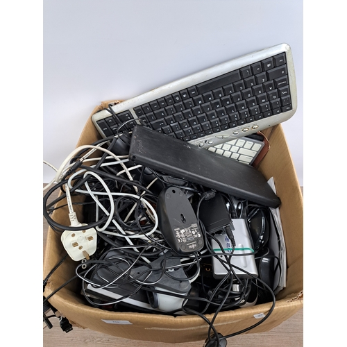 740 - A box containing a large collection of computer accessories and software