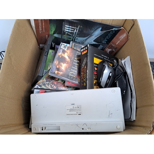 740 - A box containing a large collection of computer accessories and software