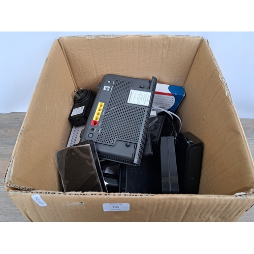 741 - A box containing various technology items to include Seagate 1TB external hard drive, BT Extender Fl... 