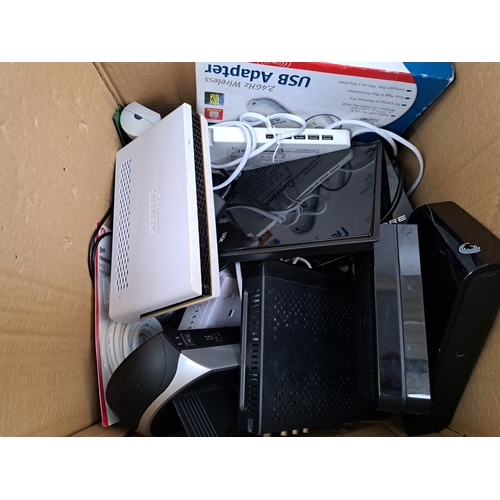 741 - A box containing various technology items to include Seagate 1TB external hard drive, BT Extender Fl... 