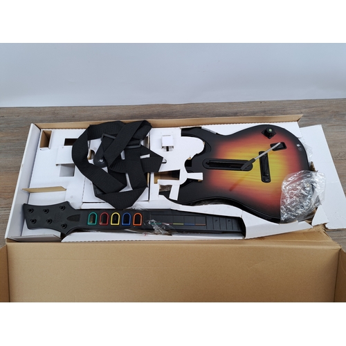 742 - Two items, one boxed PlayStation 2 Guitar Hero III Legends of Rock game and controller and one Logit... 