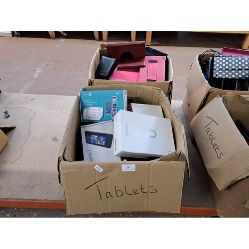 767 - Two boxes, one containing tablet cases and one containing technology items and damaged tablets to in... 