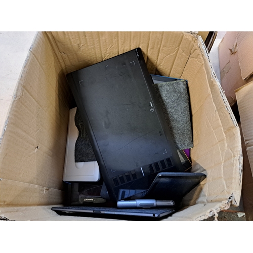 767 - Two boxes, one containing tablet cases and one containing technology items and damaged tablets to in... 