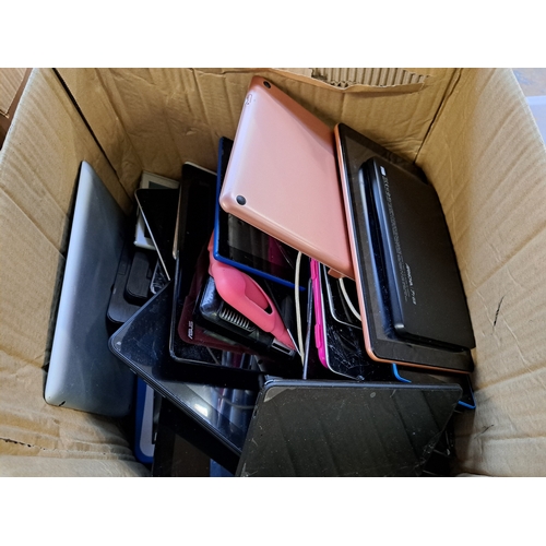 768 - Two boxes, one containing tablet cases and one containing technology items and damaged tablets to in... 