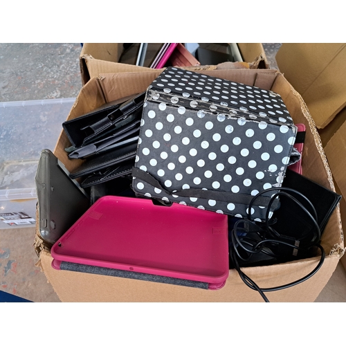 768 - Two boxes, one containing tablet cases and one containing technology items and damaged tablets to in... 