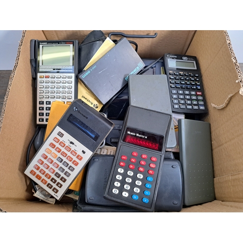 775 - A box containing a collection of calculators to include Texas Instruments Little Professor, Memory M... 