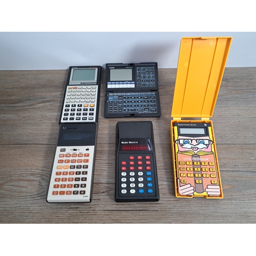 775 - A box containing a collection of calculators to include Texas Instruments Little Professor, Memory M... 