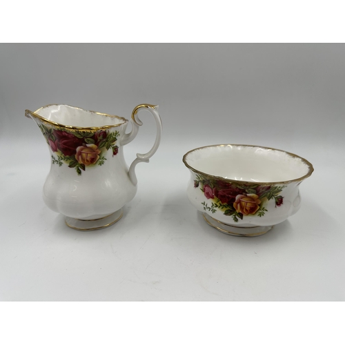 311 - A Royal Albert Old Country Roses three piece tea set comprising teapot, milk jug and sugar bowl