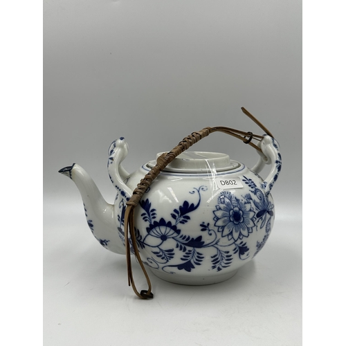 327 - Three pieces of blue and white porcelain to include Zwiebel teapot etc.