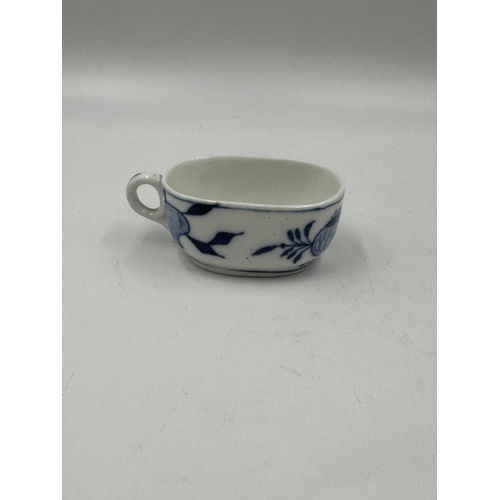 327 - Three pieces of blue and white porcelain to include Zwiebel teapot etc.