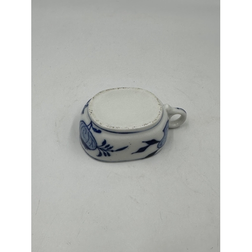 327 - Three pieces of blue and white porcelain to include Zwiebel teapot etc.