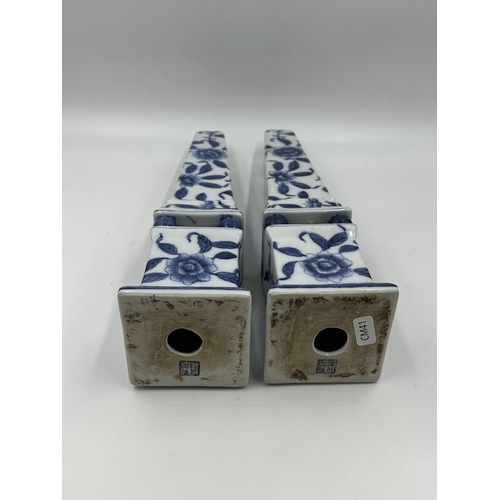 328 - A pair of Chinese blue and white porcelain obelisks - approx. 33cm high