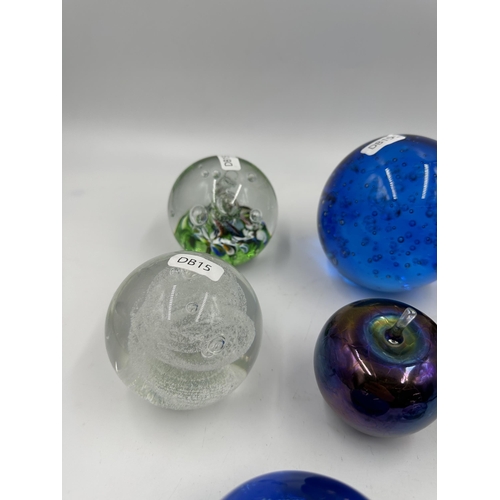 343 - Eight art glass paperweight to include four Caithness etc.