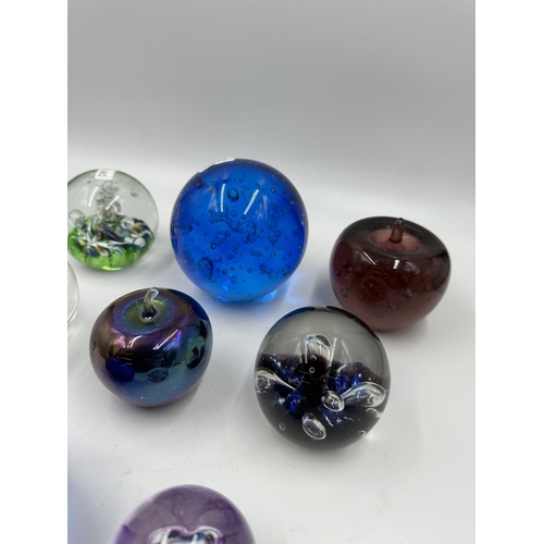 343 - Eight art glass paperweight to include four Caithness etc.