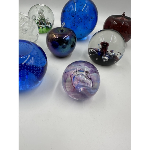 343 - Eight art glass paperweight to include four Caithness etc.