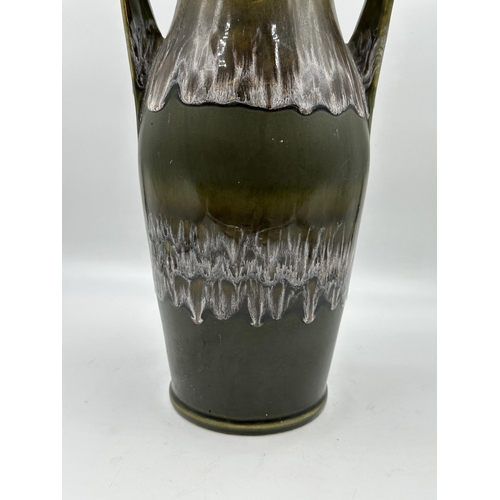 348 - A mid 20th century Kingston Pottery KP97A fat lava twin handled vase - approx. 43cm high