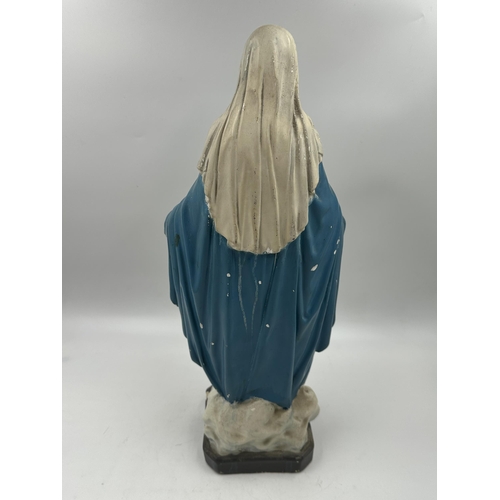 350 - A mid 20th century hand painted chalkware figurine of Mary - approx. 41cm high