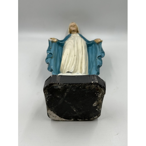 350 - A mid 20th century hand painted chalkware figurine of Mary - approx. 41cm high