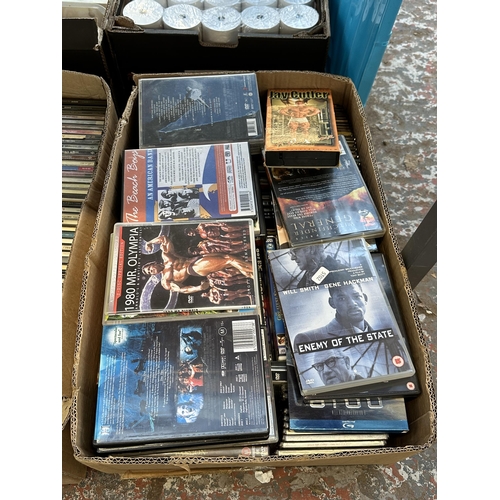 1011 - Three boxes containing CDs and DVDs