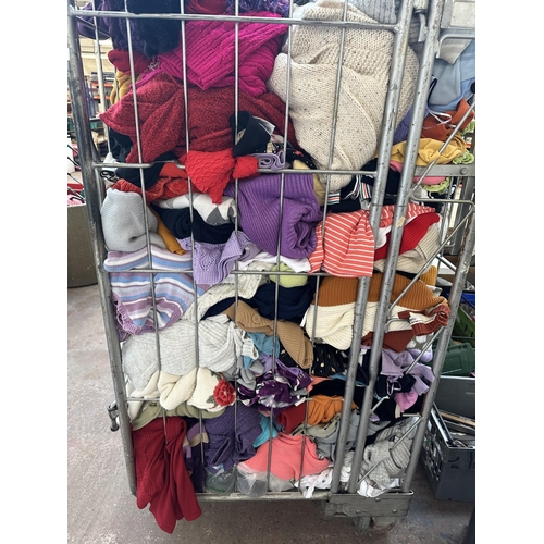 933 - A cage containing a large quantity of women's clothing (cage not included)