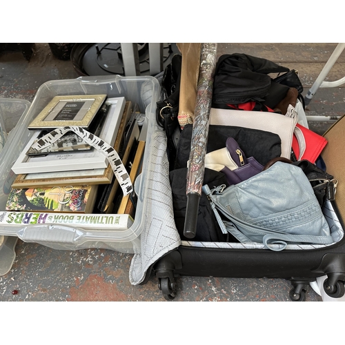 993 - Five boxes and one suitcase containing glassware, kitchenware, picture frames, women's handbags, met... 