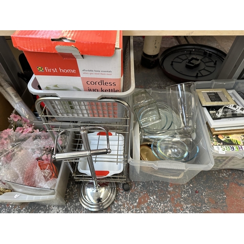 993 - Five boxes and one suitcase containing glassware, kitchenware, picture frames, women's handbags, met... 