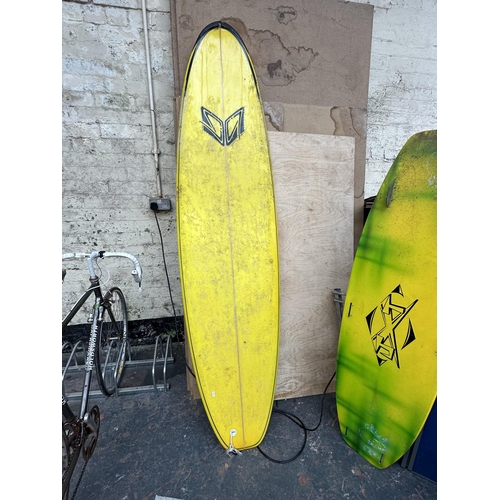 864 - Two items, one surfboard - approx. 230cm long and one JXT wakeboard - approx. 154cm long