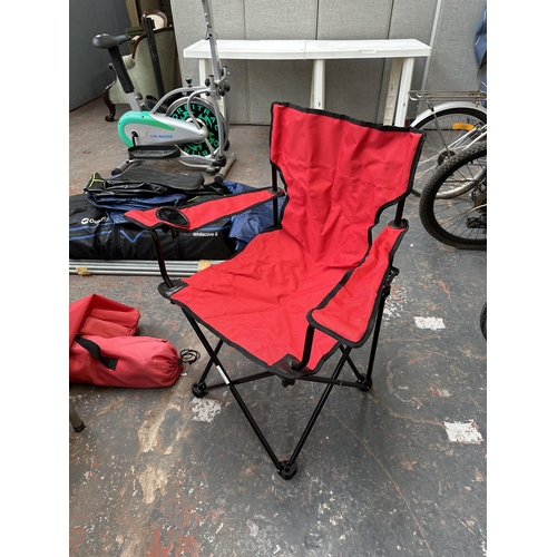 875 - Two bagged red fabric folding camping chairs