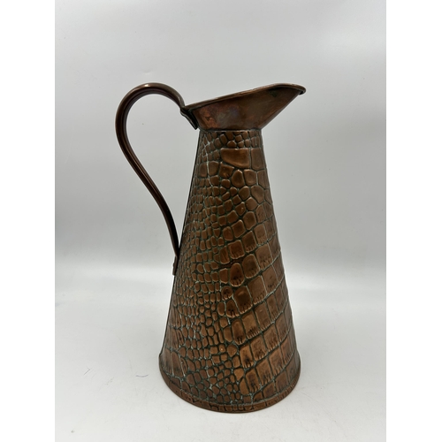 438 - A Joseph Sankey & Sons copper lizard skin pattern jug - approx. 27cm high