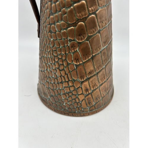 438 - A Joseph Sankey & Sons copper lizard skin pattern jug - approx. 27cm high