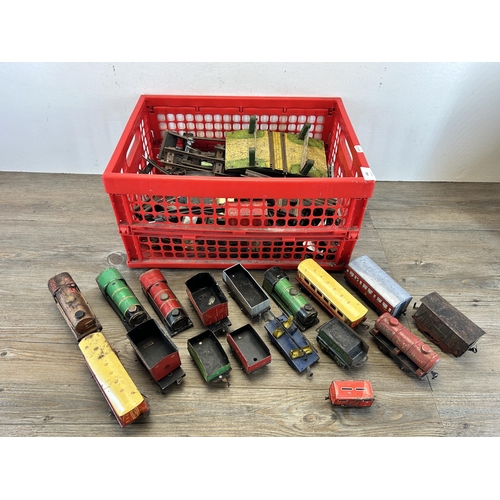 448 - A collection of vintage tinplate model railway accessories to include track, locomotives etc.