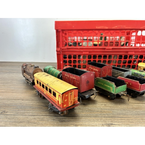 448 - A collection of vintage tinplate model railway accessories to include track, locomotives etc.