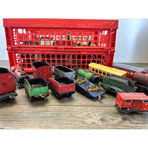 448 - A collection of vintage tinplate model railway accessories to include track, locomotives etc.