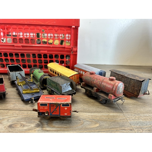 448 - A collection of vintage tinplate model railway accessories to include track, locomotives etc.