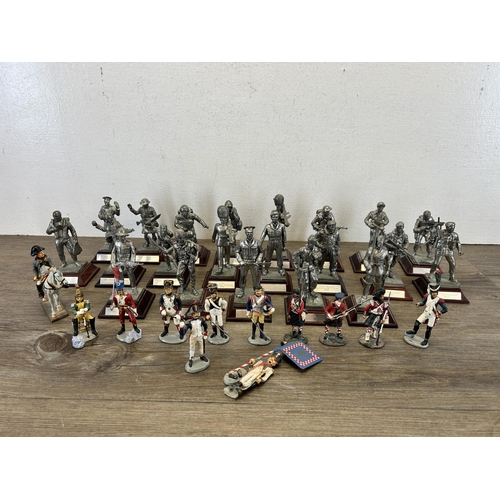 449 - A collection of military figurines to include English Miniatures The Grenadier Guards, W. Britain le... 