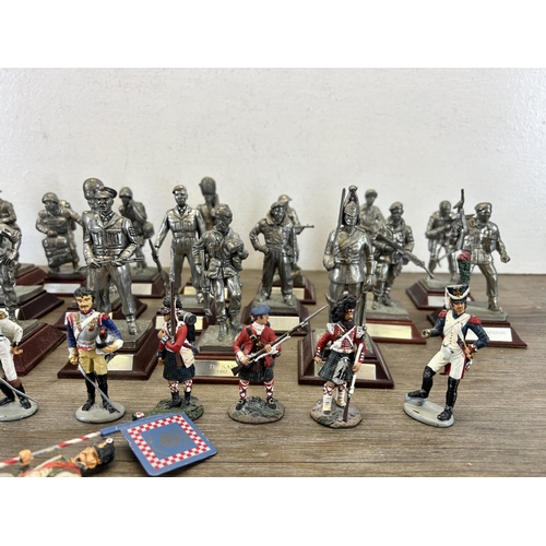 449 - A collection of military figurines to include English Miniatures The Grenadier Guards, W. Britain le... 