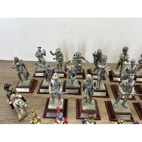 449 - A collection of military figurines to include English Miniatures The Grenadier Guards, W. Britain le... 