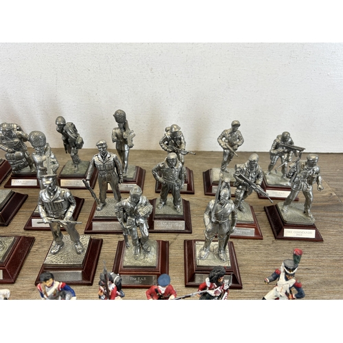 449 - A collection of military figurines to include English Miniatures The Grenadier Guards, W. Britain le... 