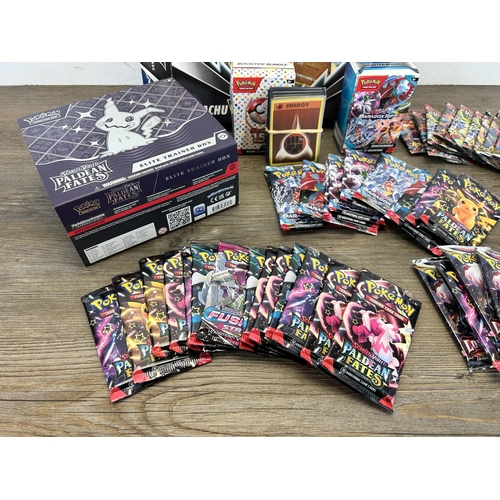 450 - A collection of Pokemon trading cards to include Scarlett & Violet Paldean Fates Elite trainer box, ... 