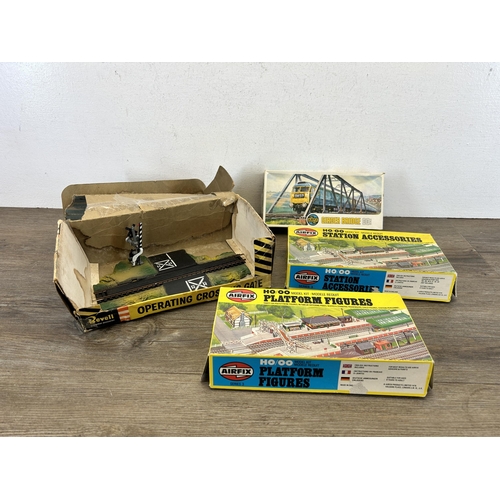 451 - A collection of model railway accessories to include boxed Airfix girder bridge, boxed Airfix statio... 