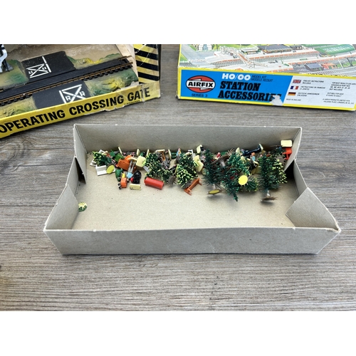 451 - A collection of model railway accessories to include boxed Airfix girder bridge, boxed Airfix statio... 