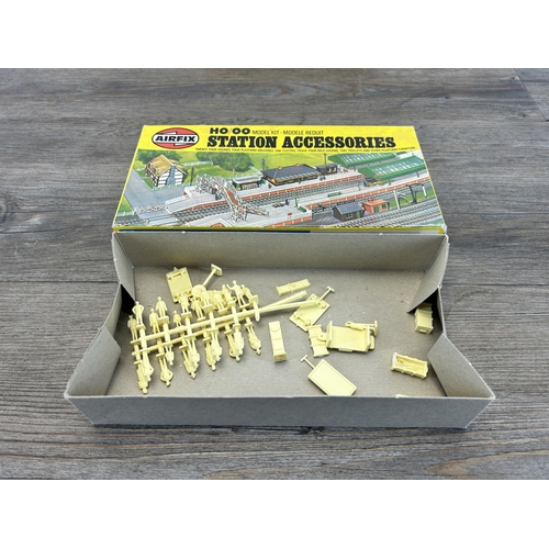 451 - A collection of model railway accessories to include boxed Airfix girder bridge, boxed Airfix statio... 