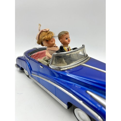 453 - A 1960s Photoing On Car Rolls Royce battery operated tinplate model vehicle