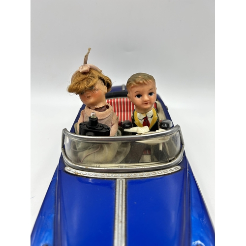 453 - A 1960s Photoing On Car Rolls Royce battery operated tinplate model vehicle