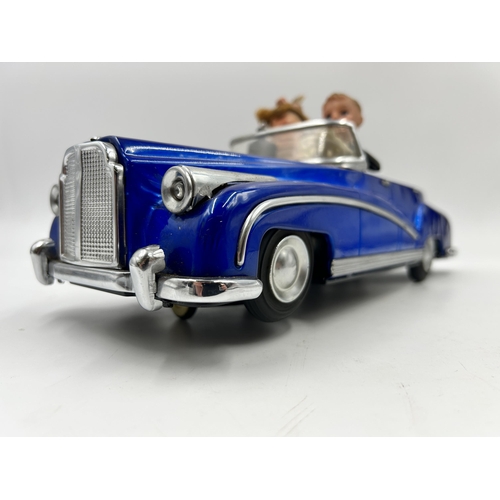 453 - A 1960s Photoing On Car Rolls Royce battery operated tinplate model vehicle