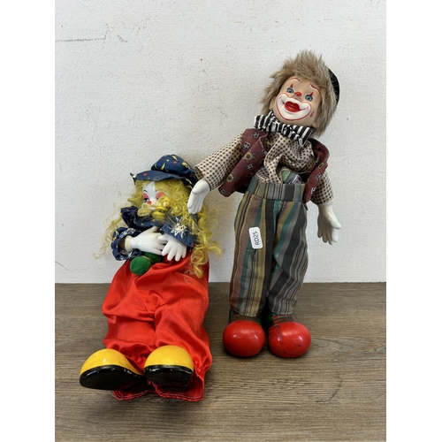 463C - Two vintage clockwork and porcelain clown figurines