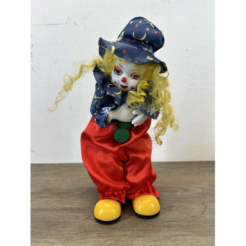 463C - Two vintage clockwork and porcelain clown figurines