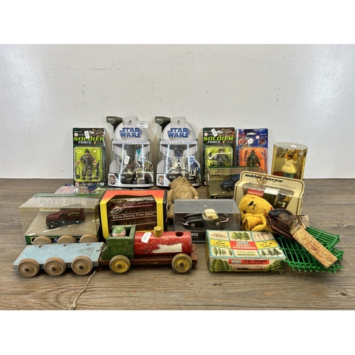 464 - A collection of toys to include vintage articulated teddy bear, boxed die cast model vehicles, boxed... 