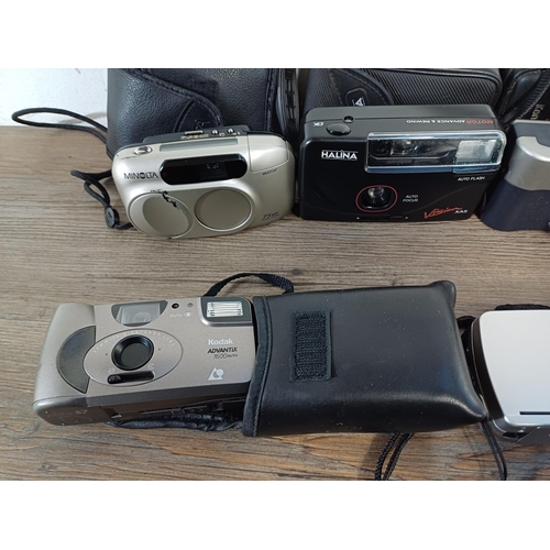 610 - A collection of compact cameras to include Minolta Riva Zoom 75W, Konica, Yashica, Halina etc.